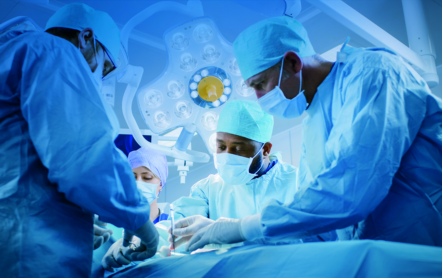 In,The,Hospital,Operating,Room,Diverse,Team,Of,Professional,Surgeons